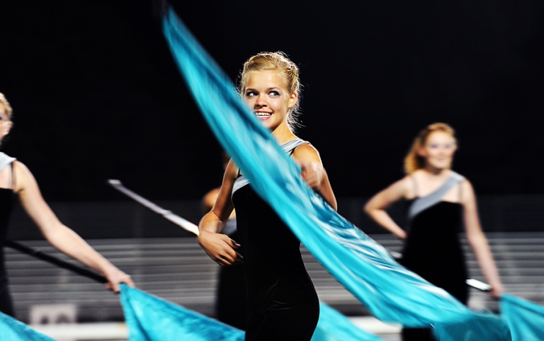 Color guard performance during a high school football half time show.