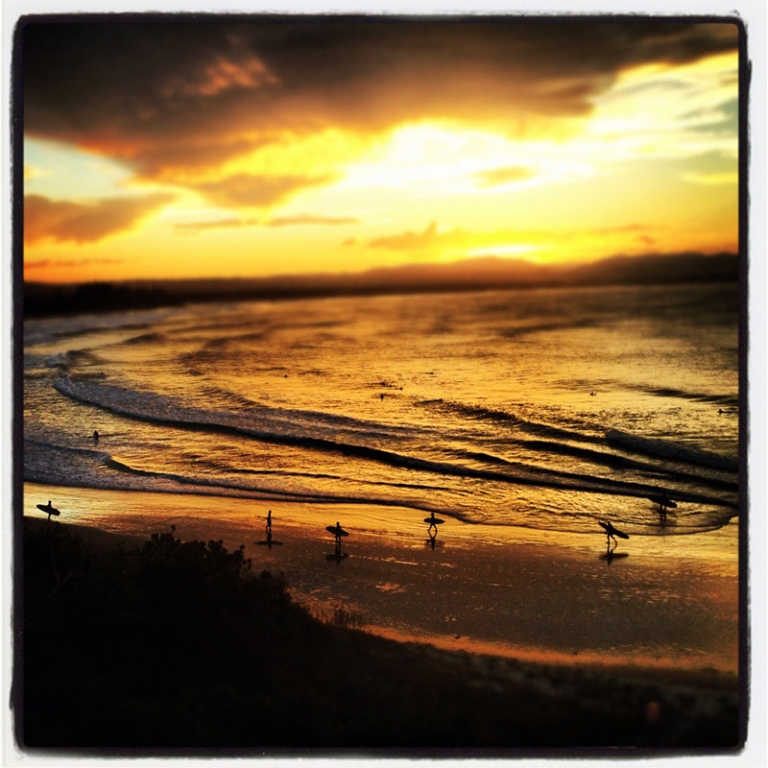 Iphone Instagram photo of surfers at New South Wales in Byron Bay Australia at sunset. by Kira Vos (Horvath)