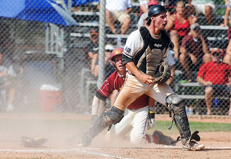 Sliding in to home plate during a baseball game in Boulder, Colorado.