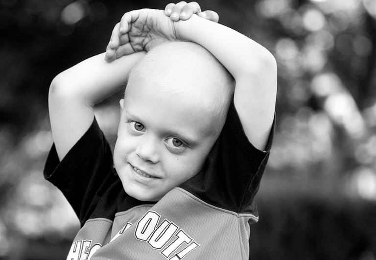 Boy with Neuroblastoma cancer playing after chemotherapy in Danvers, Massachusetts.