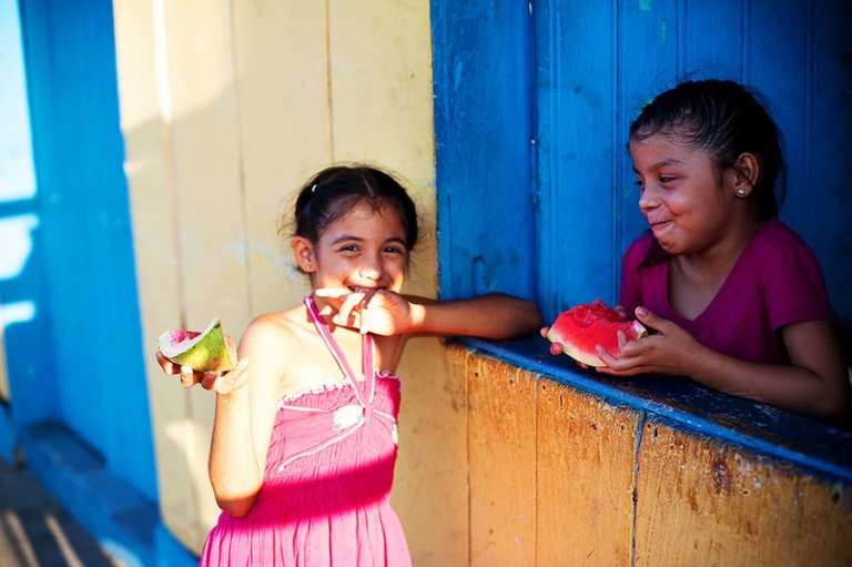 Girls eating watermelon on Isla de Ometepe Nicaragua.