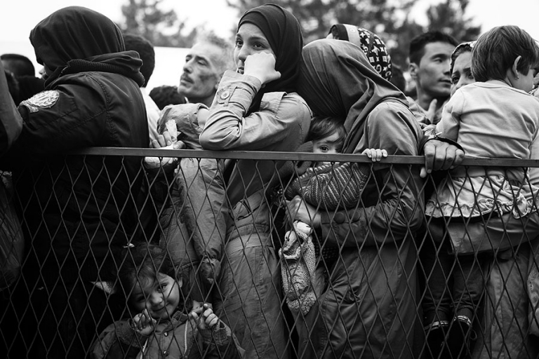 Syrian refugee's line up to wait for donations from the Red Cross at Belgrade, Serbia.  - Kira Horvath Photography
