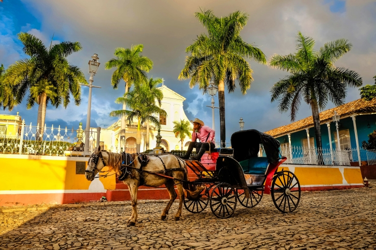 Man with horse carriage in the historic Trinidad Cuba. 